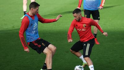 Belgium's midfielder Hans Vanaken, left, challenges Eden Hazard during a training session in Tubize. AFP