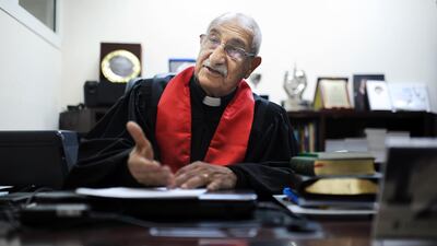 Pastor Joseph Faragalla, head of the Abu Dhabi Arabic Evangelical Church, signed the agreement the Abu Dhabi Judicial Department (ADJD) on Thursday. Delores Johnson / The National