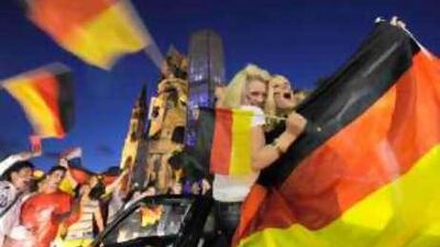 German football supporters celebrate after a victory over Austria in Euro 2008 in June.
