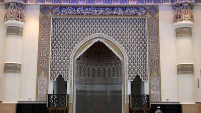 A labourer prays next to the Mehrab area in the Al Farooq mosque in Al Safa area in Dubai.