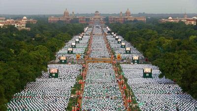 Thousands of participants perform yoga on Rajpath in New Delhi. Vijay Kumar / AFP