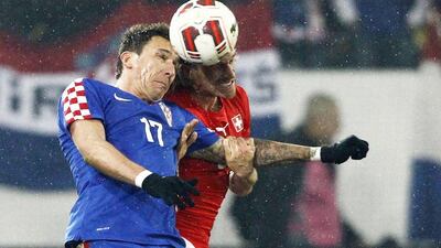 Mario Mandzukic and Croatia drew Switzerland 2-2. They'll play in Group A at the 2014 World Cup with Brazil, Mexico and Cameroon. Michael Buholzer / AFP