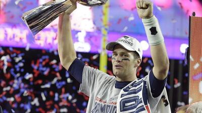 Tom Brady, the New England quaterback, hoists the Vince Lombardi Trophy after winning Super Bowl XLIX against the Seattle Seahawks. Michael Conroy / AP Photo
