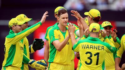 Jason Behrendorff, centre, took figures of 5-44 to bowl Australia to victory over England at the Cricket World Cup. Press Association