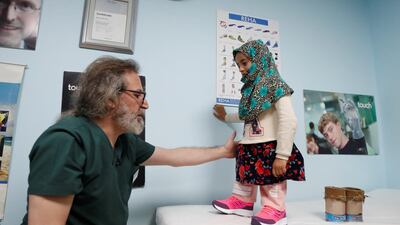 Dr Culcu said he will bear the cost of prothetic legs for May and her father. Reuters