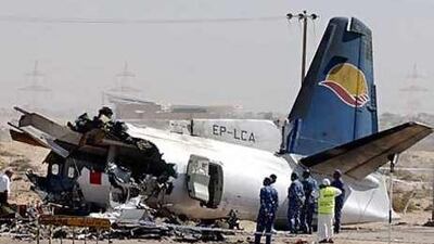 Iranian and Emirati experts inspecting the plane that crashed in Sharjah, killing 43 people on board.
