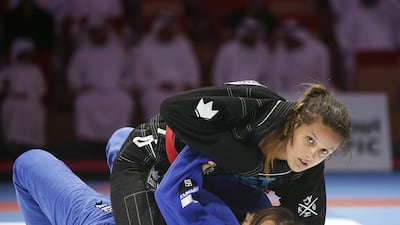 Nattily Melo de Jesus, in black, fights Jacinta Nguyen during their 90kg bout during the Abu Dhabi World Professional Jiu Jitsu Championship. Ravindranath K / The National