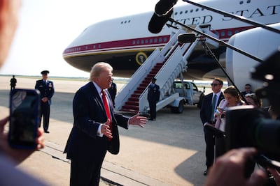 US President Donald Trump speaks before boarding. Getty Images via AFP
