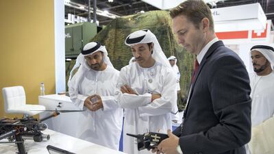 Sheikh Hazza bin Zayed at an exhibitor's booth.