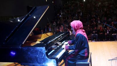 Palestinian musician Yara Thabit plays Gaza’s grand piano in a concert last year. AP