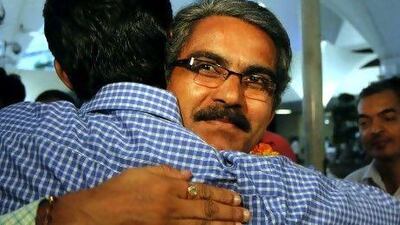 Shantilal Harji Solanki, hugging a colleauge on his safe return to Mumbai, was one of the seven Indian crew members of the Italian ship Enrica Ievoli, which was hijacked by Somali pirates on December 27.