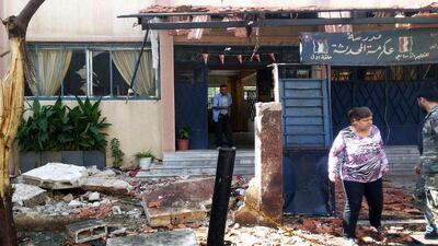The scene of a car bomb explosion outside the Akrameh Al Makhzumi school in the central Syrian city of Homs on Wednesday. Thirty children were among the at least 39 people killed. AFP