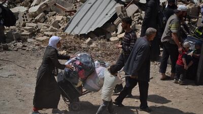 The evacuation agreement for Daraya stipulates that all citizens, including men, will leave the suburb and be transported first to shelters and then later to the north-western city of Idlib. Ahmad Mujahid/EPA