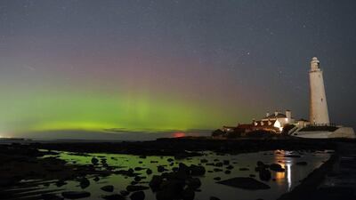 On Wednesday morning the northern lights glowed on the horizon at St Mary's Lighthouse in Whitley Bay on the north east coast. PA