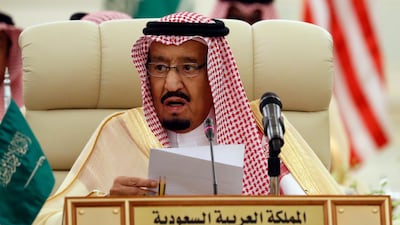 Saudi King Salman speaks during a meeting of the Saudi-Iraqi Bilateral Coordination Council. A Saudi court sentenced four people to death for links to regional rival Iran, alleging that they were plotting the assassination of "prominent figures". Alex Brandon / AP