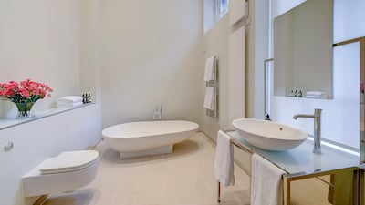 The en-suite bathroom with a bath and separate shower