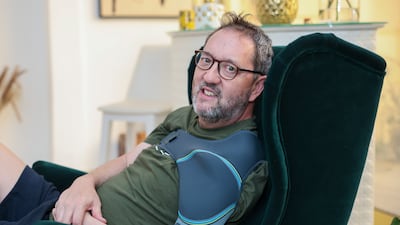 Carl Davies, pictured in 2024 after he had a stroke, has written a book on his rehabilitation. Victor Besa / The National