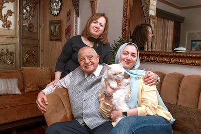 The writer with her parents and Baby Cino, the star of the house. Victor Besa / The National