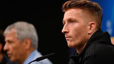 Dortmund's Swiss coach Lucien Favre and Dortmund's German forward Marco Reus are pictured during a press conference in Dortmund, western Germany, on September 16, 2019 on the eve of the UEFA Champions League Group F football match between Borussia Dortmund and Barcelona. / AFP / SASCHA SCHUERMANN