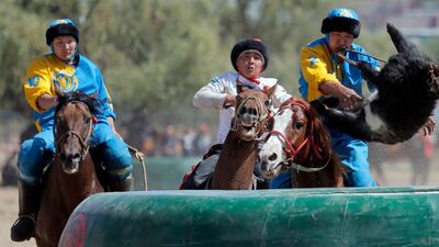 Kazakh and Russian horsemen take part in kok-boru. EPA