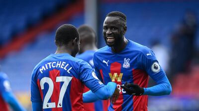 Tyrick Mitchell, left, and Cheikhou Kouyate (R) of Crystal Palace celebrate their win over Aston Villa on Sunday, May 16. EPA