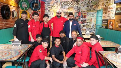 Al Ansari, centre, with his team