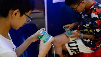 Boys playing 'Honour of Kings' by Tencent. The Chinese company posted revenue growth from PC and mobile games in the second quarter of 2023. Reuters