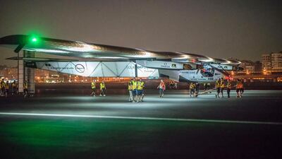 Solar Impulse 2 technicians prepare the plane for flight at Cairo with Bertrand Piccard at the controls. Jean Revillard / AFP