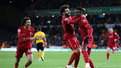 Liverpool's Divock Origi, right, celebrates with Mohamed Salah after scoring. PA
