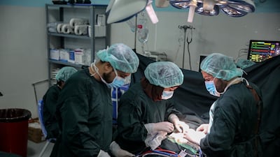 Doctors perform a surgery at the first specialised hospital for children with congenital heart defects in Kabul, Afghanistan earlier this month. Proponents of surgery postulate huge benefits but only if millions are first invested in new infrastructure and costly machinery. EPA