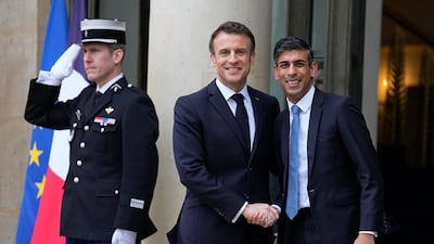 France's President Emmanuel Macron welcomes Britain's Prime Minister Rishi Sunak to the Elysee Palace in Paris on March 10. AP