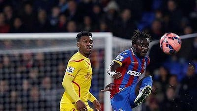 Crystal Palace defender Pape Souare, right, clears the ball as Liverpool striker Daniel Sturridge looks on during their English FA Cup fifth round football match at Selhurst Park in south London on February 14, 2015. AFP PHOTO / JUSTIN TALLIS