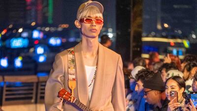 A guitar-shaped bag paid homage to Williams' musical roots. Getty Images