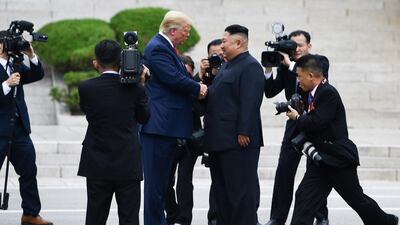 US President Donald Trump shakes hands with North Korean leader Kim Jong-un at the demilitarised zone separating the two Koreas, in Panmunjom, South Korea. AFP