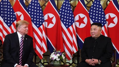 President Donald Trump listens to North Korea's leader Kim Jong-un during a meeting at the Sofitel Legend Metropole hotel in Hanoi. AFP