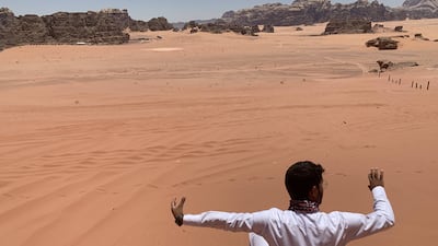 Yanal Abdulaziz Al Zawaidah sitting at the spot where Matt Damon set up his camp in 'The Martian'. All photos: Razmig Bedirian / The National