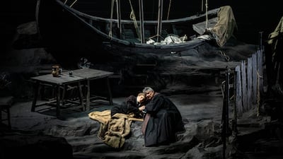 The home of assassin Sparafucile is suitably forbidding with its discarded rocks, grime and weathered furniture.