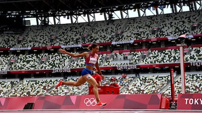 USA's Sydney Mclaughlin crosses the finish line to win the women's 400m hurdles final setting a new world record.