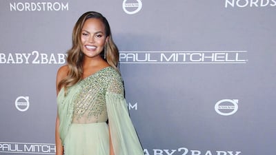 Chrissy Teigen wears Georges Hobeika for the Baby2Baby launch. Supplied