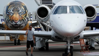An Embraer E-190 E2 aircraft featuring a spray painted tiger face on the nose of the aircraft is displayed during a media preview of the Singapore Airshow in February. The E2 is Embraer's latest re-engined family of 70 to 130-seat passenger jet. REUTERS/Edgar Su