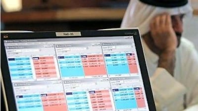 Gulf markets fell after the US credit downgrade with Qatar and the UAE posting the biggest declines. Above, an investor ponders his next move.