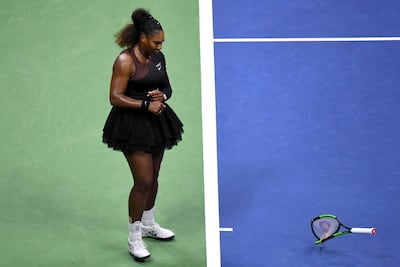 Serena Williams smashes her racket during the women's final, earning the American a second code violation. Reuters