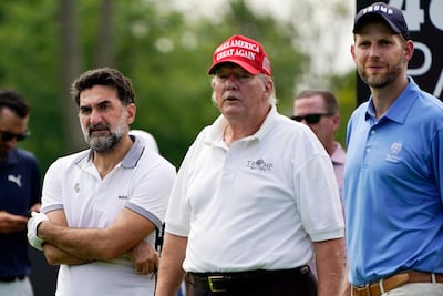 PIF governor Yasir Al Rumayyan, left, US President Donald Trump, centre, and his son Eric Trump, playing golf together at a LIV event in New Jersey in July 2022. AP