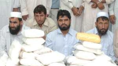 Alleged smugglers in Sharjah with 202kg of seized narcotics; seizures of hashish, opium and heroin all rose last year.