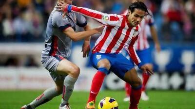 With the January transfer window approaching a name that keeps popping up is striker Radamel Falco, right, but the Colombian says he would be happy to remain with Atletico Madrid.