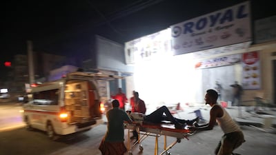 An injured man is taken away from the scene. Reuters