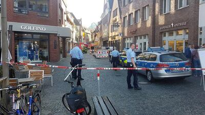 Policemen stand at a barricade to the inner city of Munster, Germany, after an car ramming attack on April 7, 2018 that killed at least three people. Nord-West Media / EPA