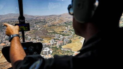 An aerial view of houses and agricultural fields in Lebanon's eastern Bekaa Valley during a Lebanese air force tourist flight.