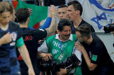 Croatia players celebrate next to AFP photographer Yuri Cortez after Mario Mandzukic scores their second goal. Reuters