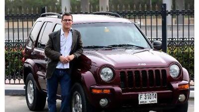 Austyn Allison with what will soon be his Jeep Cherokee in Dubai.